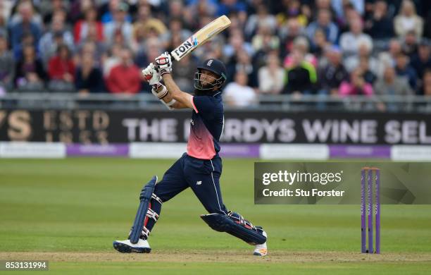 England batsman Moeen Ali hits a six during his century during the 3rd Royal London One Day International between England and West Indies at The...