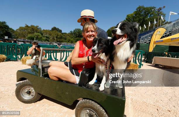 Dogs are seen riding a miniature car at the 4th Annual Rolex Central Park horse show at Wollman Rink, Central Park on September 24, 2017 in New York...