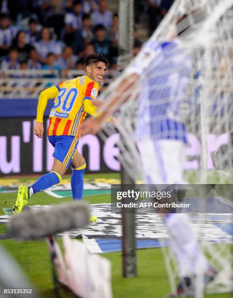 Valencia's defender from Spain Nacho Vidal celebrates after scoring his team's second goal during the Spanish league football match Real Sociedad vs...