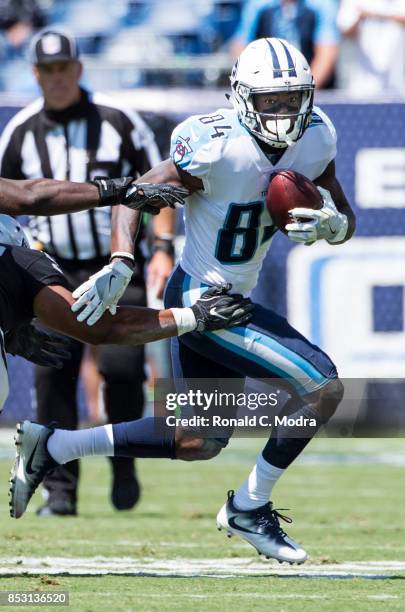 Wide receiver Corey Davis of the Tennessee Titans carries the ball during a game against the Oakland Raiders at Nissan Stadium on September 10, 2017...