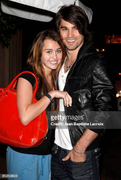 Singer Miley Cyrus and model Justin Gaston visit Nubu March 9, 2009 in West Hollywood, California.