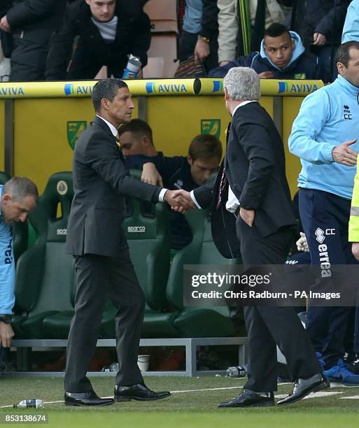 Norwich City's manager Chris Hughton shakes hands with Stoke City manager Mark Hughes after the final whistle