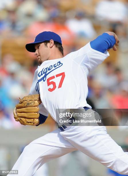 Scott Elbert of the Los Angeles Dodgers pitches during a Spring Training game against the San Francisco Giants at Camelback Ranch on March 4, 2009 in...