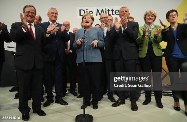 German Chancellor and Christian Democrat Angela Merkel , standing with leading members of both the CDU and the Bavarian Chrisitan Democrats , speaks...