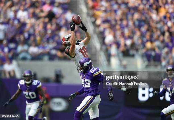 Adam Humphries of the Tampa Bay Buccaneers catches the ball over defender Terence Newman of the Minnesota Vikings in the second half of the game on...