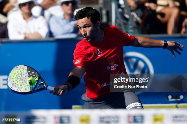 Carlos Gutierrez of Argentina hits a backhand playing with Francisco Navarro of Spain during the Portugal Masters Padel 2017 men's doubles final...