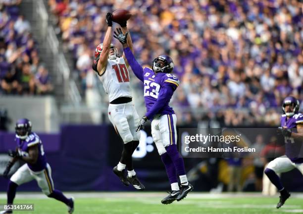 Adam Humphries of the Tampa Bay Buccaneers catches the ball over defender Terence Newman of the Minnesota Vikings in the second half of the game on...