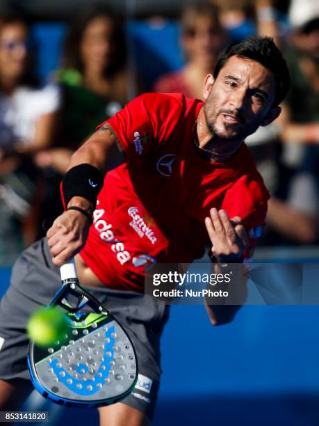 Carlos Gutierrez of Argentina hits a backhand playing with Francisco Navarro of Spain during the Portugal Masters Padel 2017 men's doubles final...