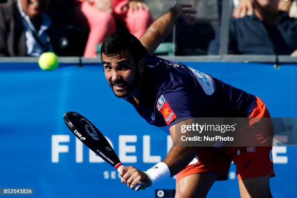 Pablo Lima of Brasil hits a backhand playing with Fernando Belasteguin of Argentina during the Portugal Masters Padel 2017 men's doubles final match...