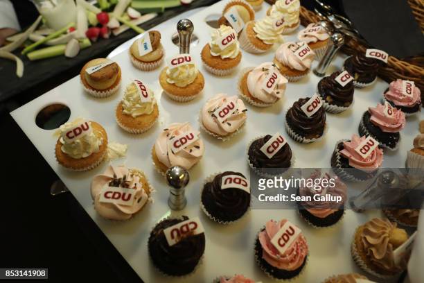 Cupcakes decorated with the logo of the German Christian Democrats are on display at CDU headquarters at the end of the election evening following...