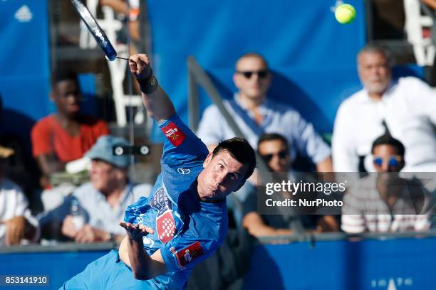 Francisco Navarro of Spain hits a backhand playing with Carlos Gutierrez of Argentina during the Portugal Masters Padel 2017 men's doubles final...