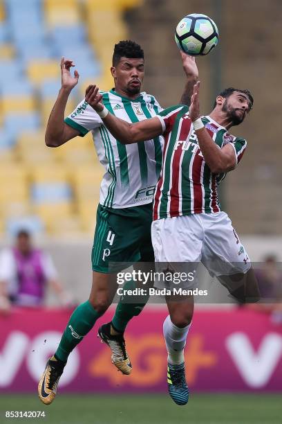 Henrique Dourado of Fluminense struggles for the ball with Juninho of Palmeiras during a match between Fluminense and Palmeiras as part of...