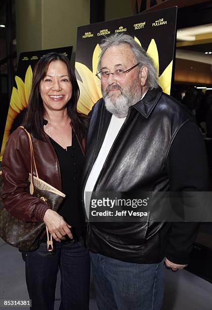 ThinkFilm's David Tuckerman and guest arrive to the Film Independant screening of "Phoebe In Wonderland" held at the WGA Theatre on March 1, 2009 in...