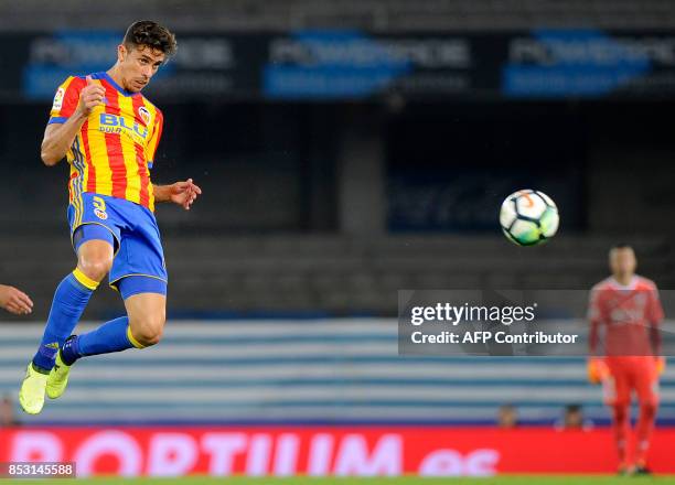 Valencia's defender from Brazil Gabriel Paulista heads the ball during the Spanish league football match Real Sociedad vs Valencia CF at the Anoeta...