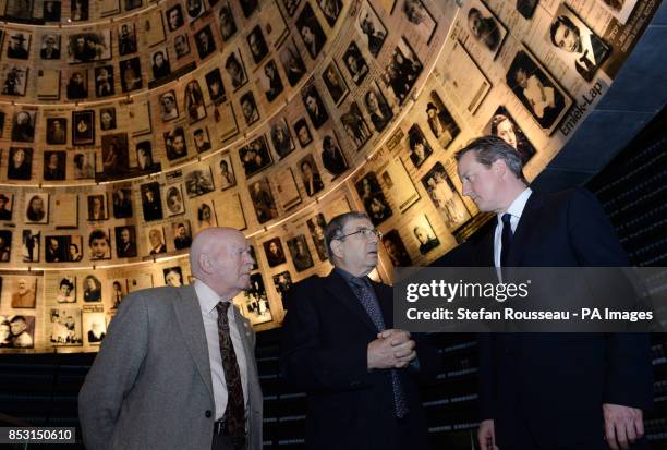 Prime Minister David Cameron is shown around the Hall of Names at the Holocaust museum, Yad Vashem in Jerusalem by museum chairman, Avner Shalev, and...