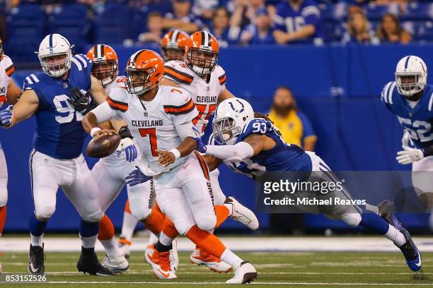 Jabaal Sheard of the Indianapolis Colts tackles DeShone Kizer of the Cleveland Browns during the second half at Lucas Oil Stadium on September 24,...