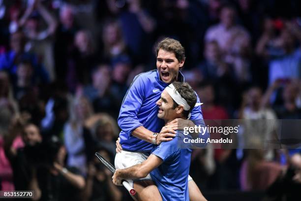 Switzerland's Roger Federer of Team Europe celebrates with his team mate Spanish Rafael Nadal after his match against Australia's Nick Kyrgios of the...