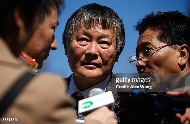Chinese dissident Wei Jing Sheng speaks to the media during a rally on "free Tibet" at the Lafayette Square, north of the White House, March 9, 2009...