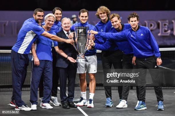Members of the Team Europe along with Former tennis player Rod Laver pose with the trophy as they celebrate winning the Laver Cup tennis tournament...