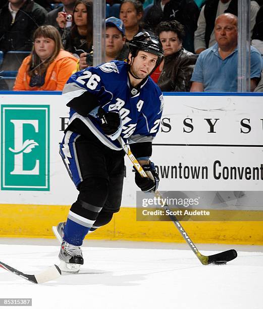 Martin St. Louis of the Tampa Bay Lightning passes the puck against the Pittsburgh Penguins at the St. Pete Times Forum on March 3, 2009 in Tampa,...