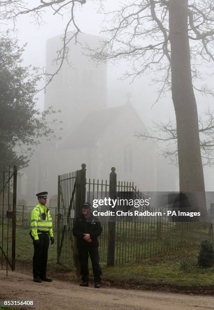 Police at a cordon on the A146 after four people have died when a helicopter came down in thick fog in a field in Gillingham, near Beccles, Norfolk,...