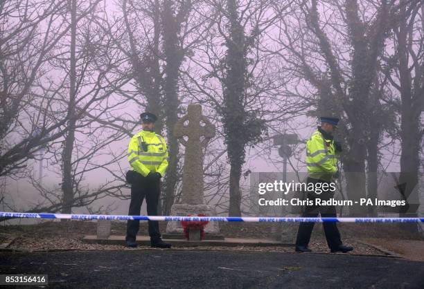 Police at a cordon on the A146 after four people have died when a helicopter came down in thick fog in a field in Gillingham, near Beccles, Norfolk,...