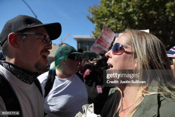 Protesters shout at each other during a free speech rally with right wing commentator Milo Yiannopoulos at U.C. Berkeley on September 24, 2017 in...