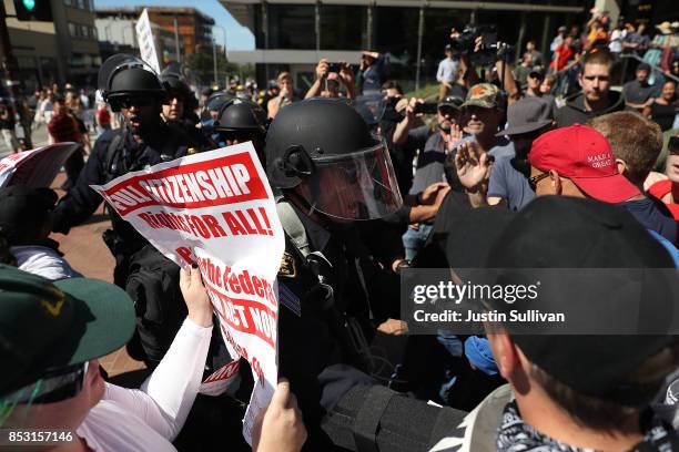 Police officers push through a group of protesters during a free speech rally with right wing commentator Milo Yiannopoulos at U.C. Berkeley on...