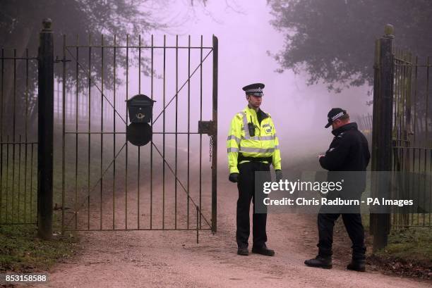 At the gates of St Marys Chuch on the A146 after four people have died when a helicopter came down in thick fog in a field in Gillingham, near...