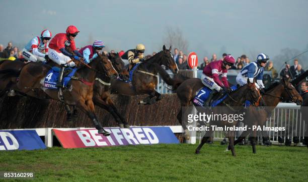 Last Instalment ridden by Brian O'Connell and Teaforthree ridden by Nick Scholfield jump the last in The Betfred Cheltenham Gold Cup Steeple Chase...
