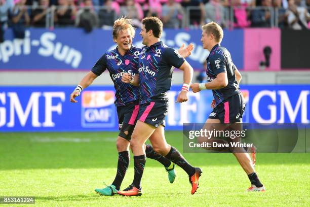 Morne Steyn of Stade Francais Paris is congratulated by Charl McLeod of Stade Francais Paris after landing a drop goal during the Top 14 match...