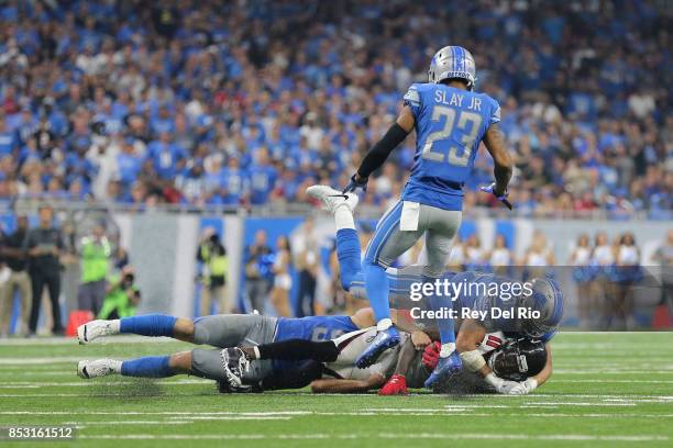 Julio Jones of the Atlanta Falcons makes a catch and tackled by Miles Killebrew of the Detroit Lions at Ford Field on September 24, 2017 in Detroit,...