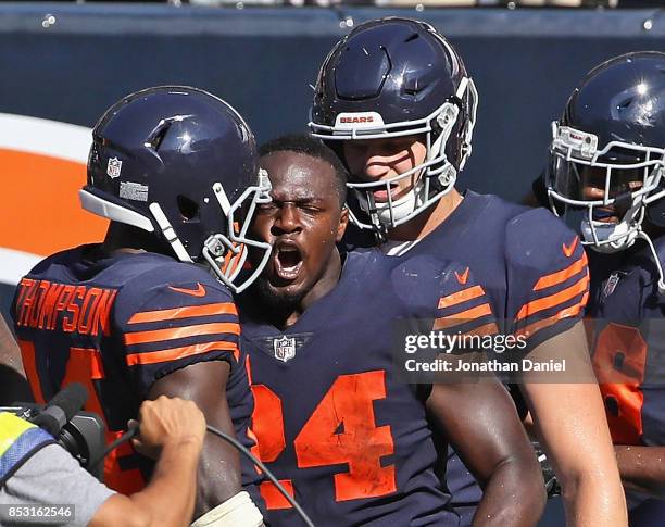 Jordan Howard of the Chicago Bears celebrates with teammates Deonte Thompson and Adam Shaheen after scoring the game-winning touchdown in overtime...