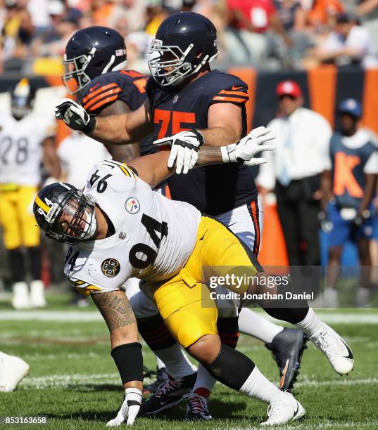 Tyson Alualu of the Pittsburgh Steelers rushes past Kyle Long of the Chicago Bears at Soldier Field on September 24, 2017 in Chicago, Illinois. The...