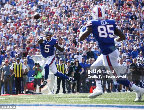 Tyrod Taylor of the Buffalo Bills throws the ball to his teammate Charles Clay of the Buffalo Bills during an NFL game against the Denver Broncos on...