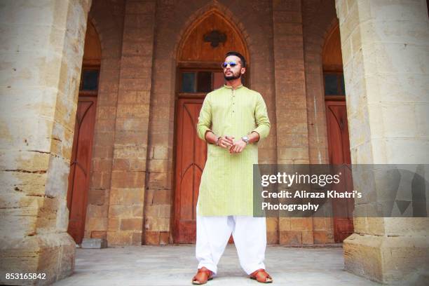 middle eastern india pakistan men's wear style - kurta stock pictures, royalty-free photos & images