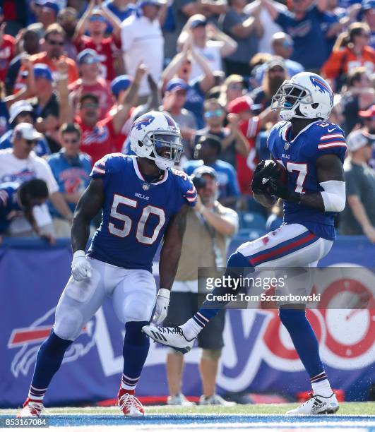 Ramon Humber of the Buffalo Bills and teammate Tre'Davious White celebrate during an NFL game against the Denver Broncos on September 24, 2017 at New...