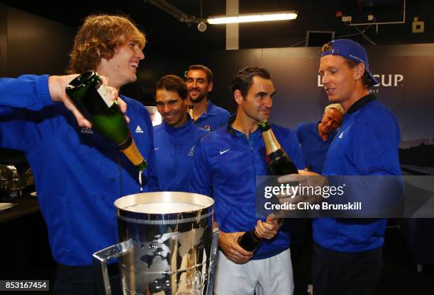 Alexander Zverev, Rafael Nadal, Roger Federer and Tomas Berdych of Team Europe drink champagne after winning the Laver Cup on the final day of the...