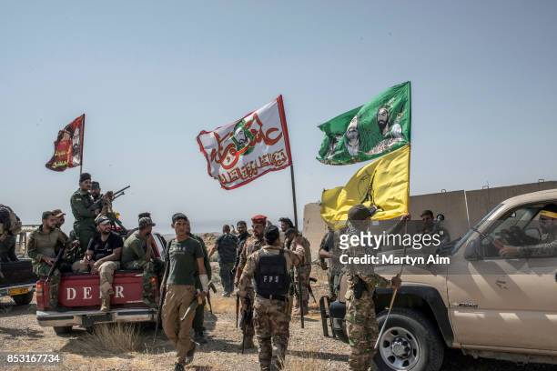 Soldiers of the Hashd Al-Shaabi prepare to fight in an offensive to drive out Islamic State militants on September 24, 2017 in Hawija, Iraq. The...