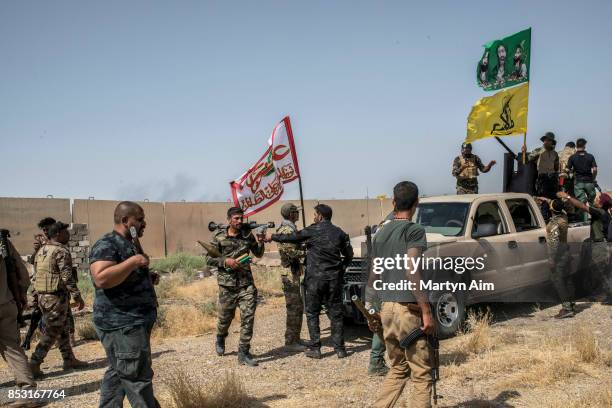 Soldiers of the Hashd Al-Shaabi prepare to fight in an offensive to drive out Islamic State militants on September 24, 2017 in Hawija, Iraq. The...