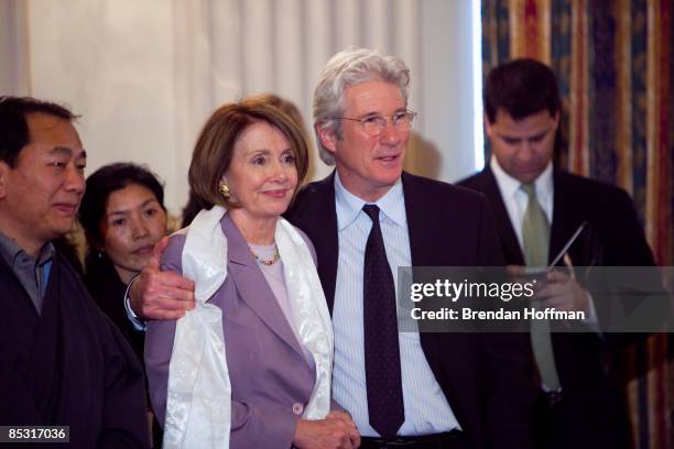 Actor Richard Gere puts his arm around House Speaker Nancy Pelosi at an event advocating for greater freedoms in Tibet on March 9, 2009 in...