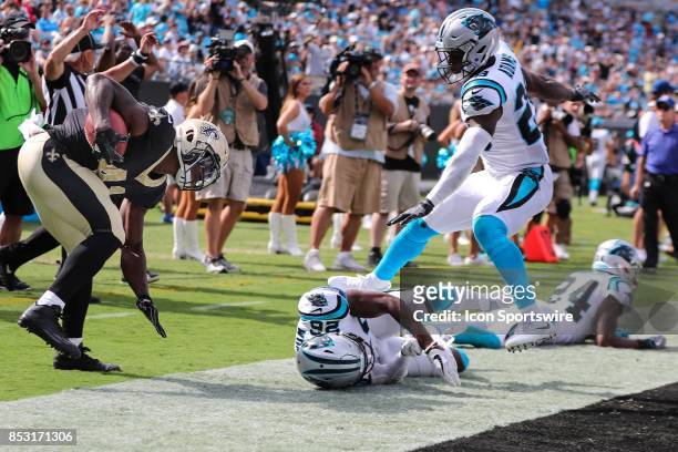 Carolina Panthers cornerback Daryl Worley gives a parting shot as New Orleans Saints wide receiver Corey Fuller scores during the second half of the...
