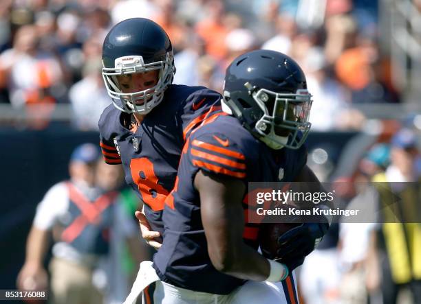 Quarterback Mike Glennon of the Chicago Bears hands the football off to Jordan Howard in the first quarter against the Pittsburgh Steelers at Soldier...