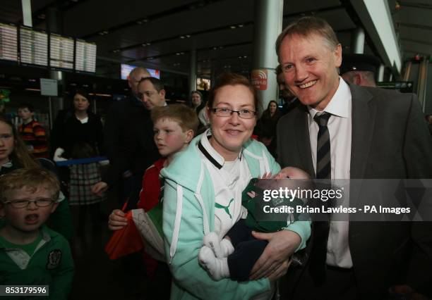 Ireland head coach Joe Schmidt with Liz Keenan and her 4 month old son Oisin, from Cooley, Louth, as the Ireland team arrive at Dublin Airport,...