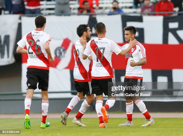 Gonzalo Martinez of River Plate celebrates with teammates Ignacio Scocco, Carlos Auzqui and Ignacio Fernandez after scoring the first goal of his...