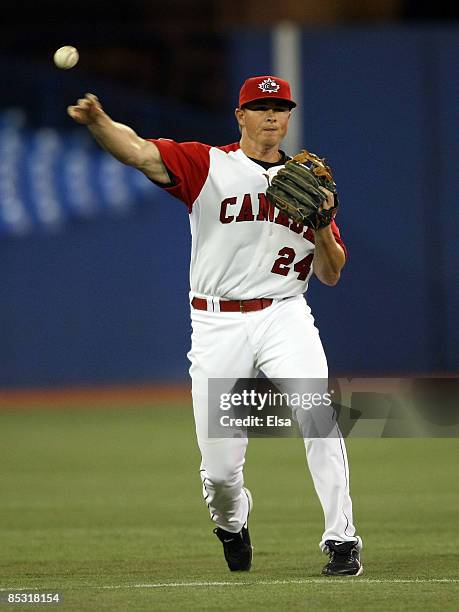 Mark Teahen of Canada throws to first base for the out against Italy during the 2009 World Baseball Classic Pool C match on March 9, 2009 at the...