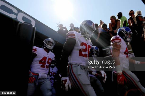 Paul Perkins of the New York Giants and Curtis Grant of the New York Giants take the field against the Philadelphia Eagles on September 24, 2017 at...