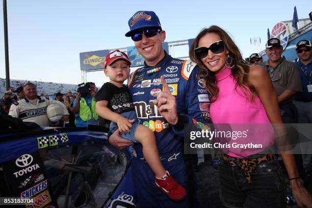 Kyle Busch, driver of the M&M's Caramel Toyota, celebrates in Victory Lane with his wife Samantha and son Brexton after the Monster Energy NASCAR Cup...