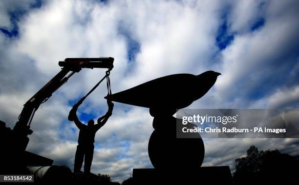 Bronze sculpture of a Peregrine Falcon weighing 1.5 tonnes and standing 3 metres tall is lifted into place at Hatfield house in Hertfordshire, as the...