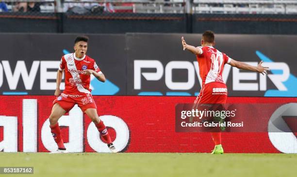 Nicolas Gonzalez of Argentinos Juniors celebrates with teammate Braian Romero after scoring the first goal of his team during a match between River...